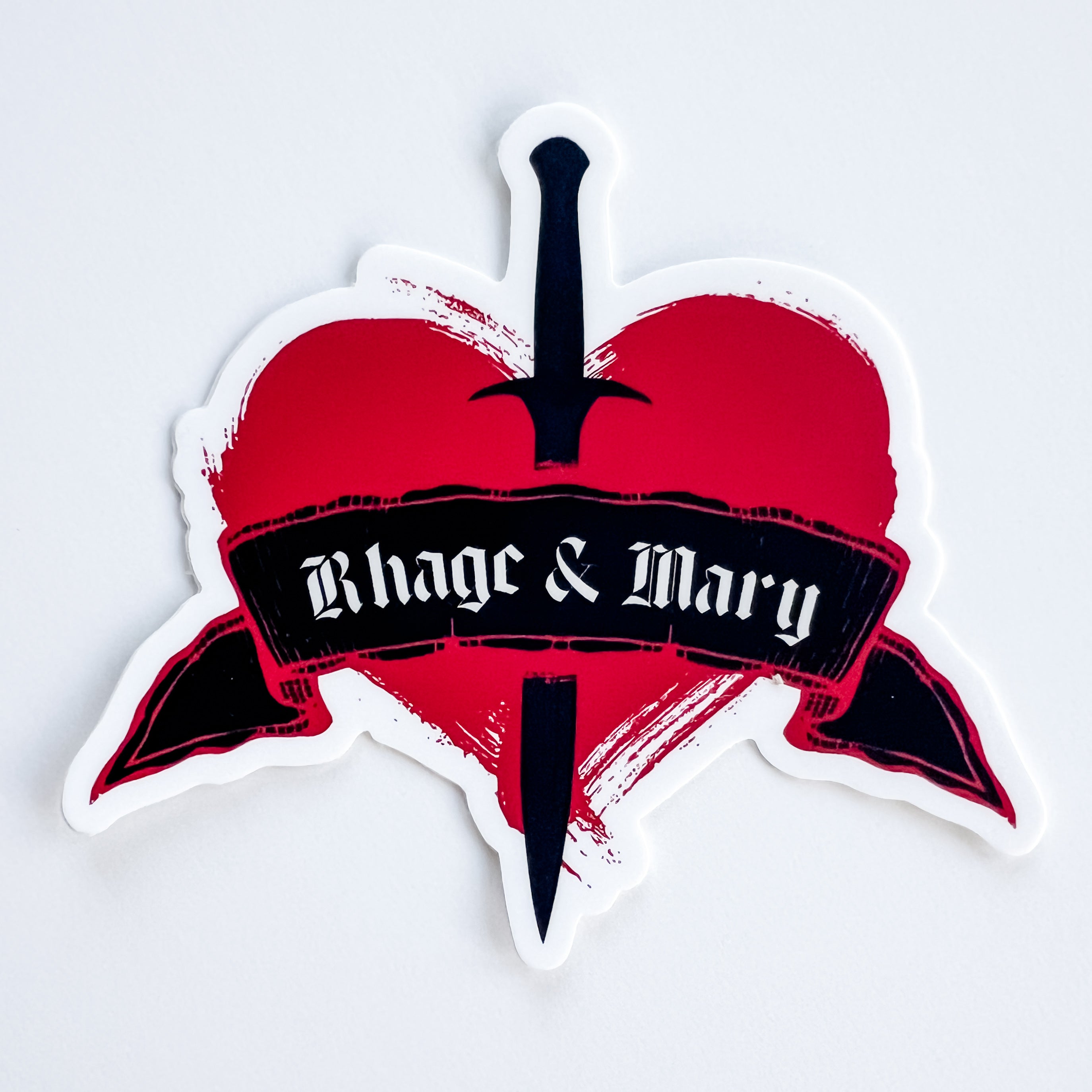 Sticker with a red heart and black dagger design, featuring the text 'Rhage & Mary' on a white background.