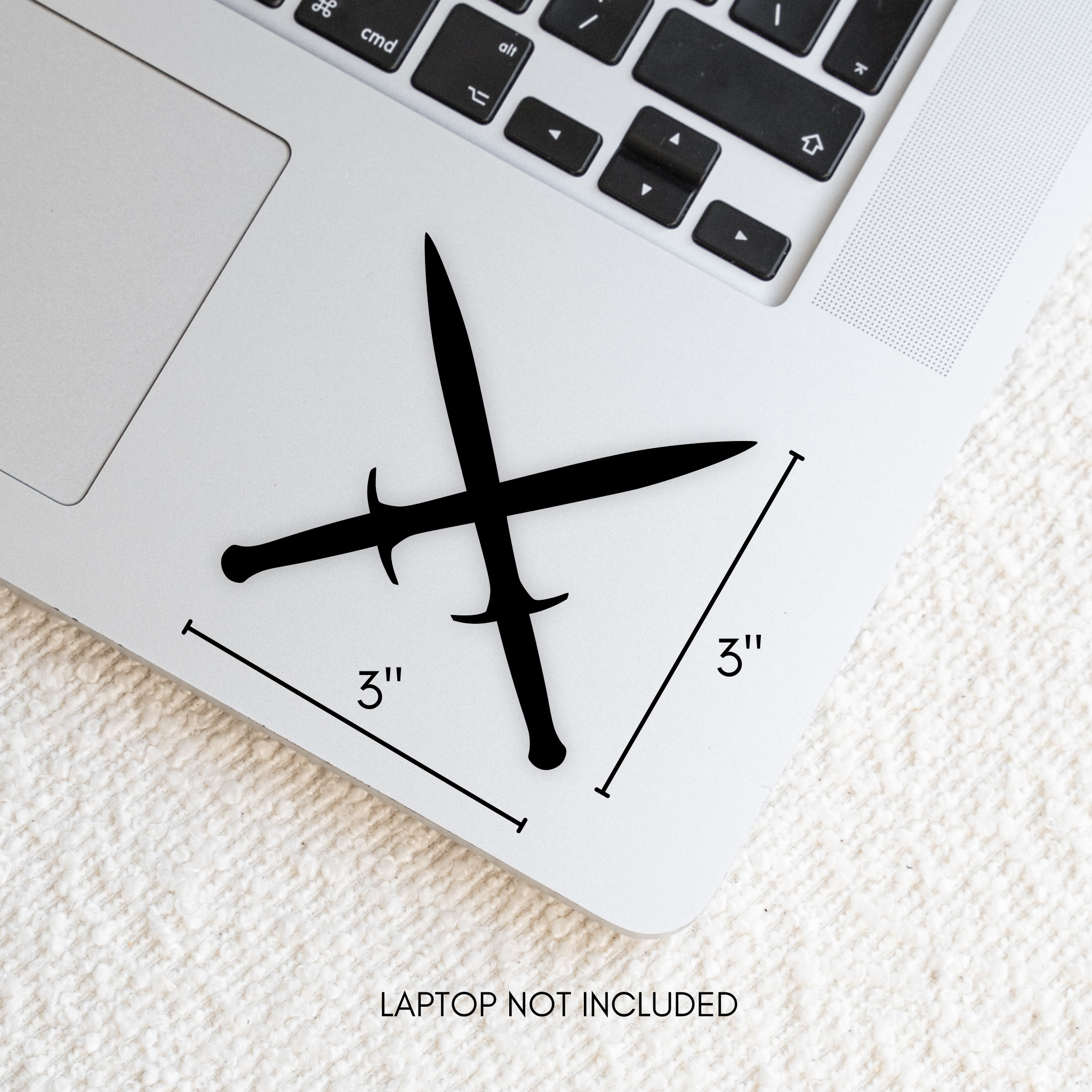 Black crossed daggers decal design with measurements on a laptop