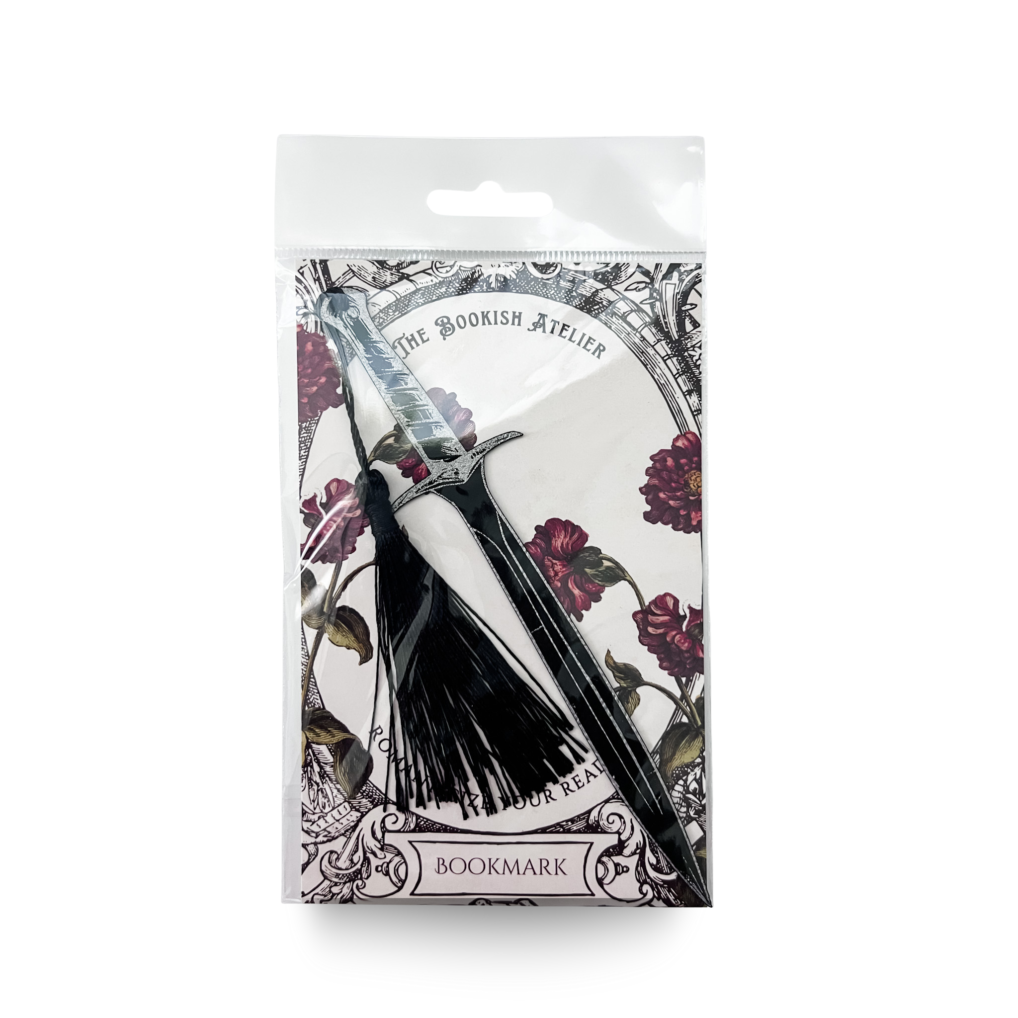 Packaged black dagger bookmark with tassel on a white background