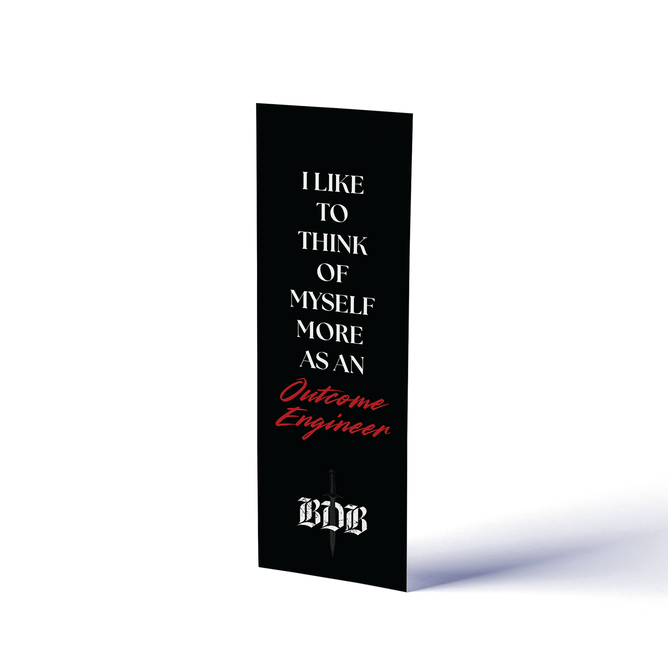 Black book with text "I like to think of myself more as an Outcome Engineer" on a white background