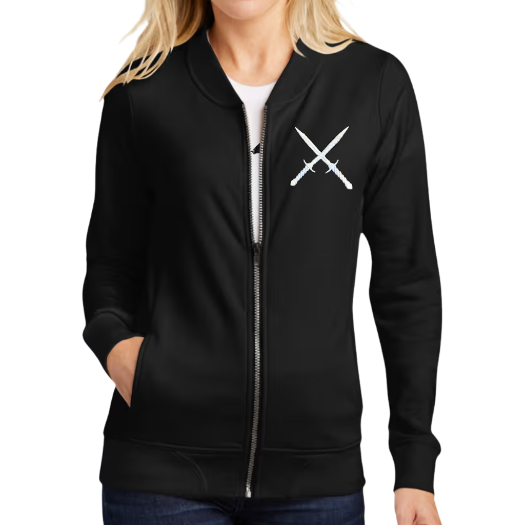 a woman wearing a black french terry jacket with white crossed daggers embroidered on the chest