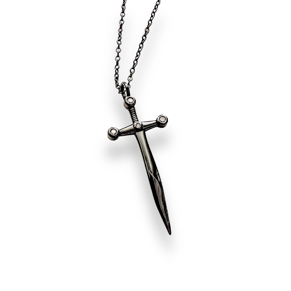 Black dagger-shaped pendant on a chain against a white background