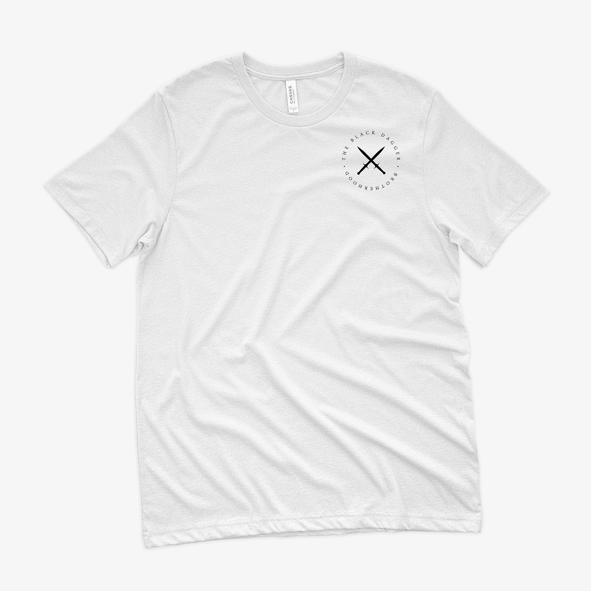 the front of a white shirt with an emblem on the top left shoulder. It's a circle with crossed black daggers and the words "Black Dagger Brotherhood" encircling it.