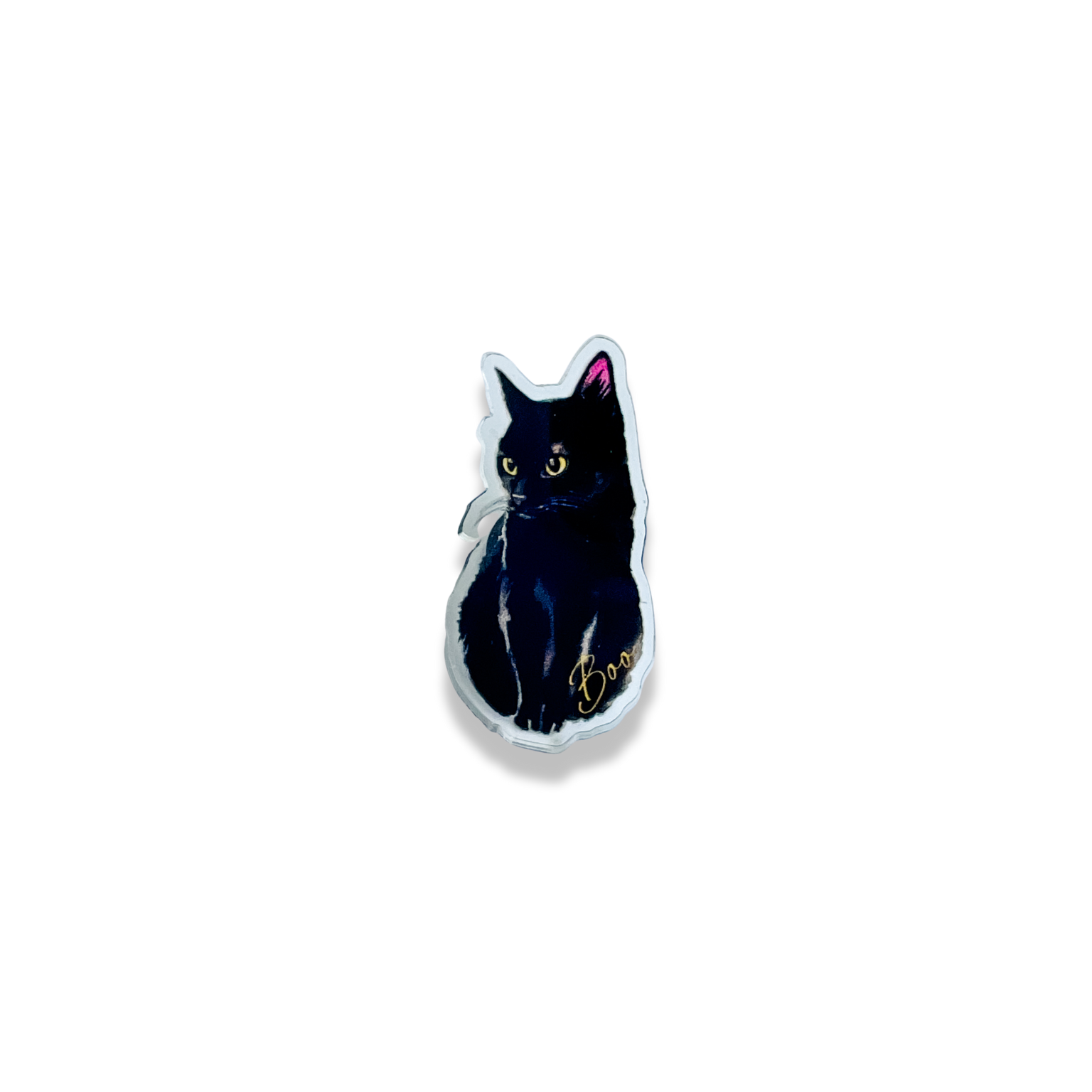 a black cat pin with the word "Boo" written in cursive