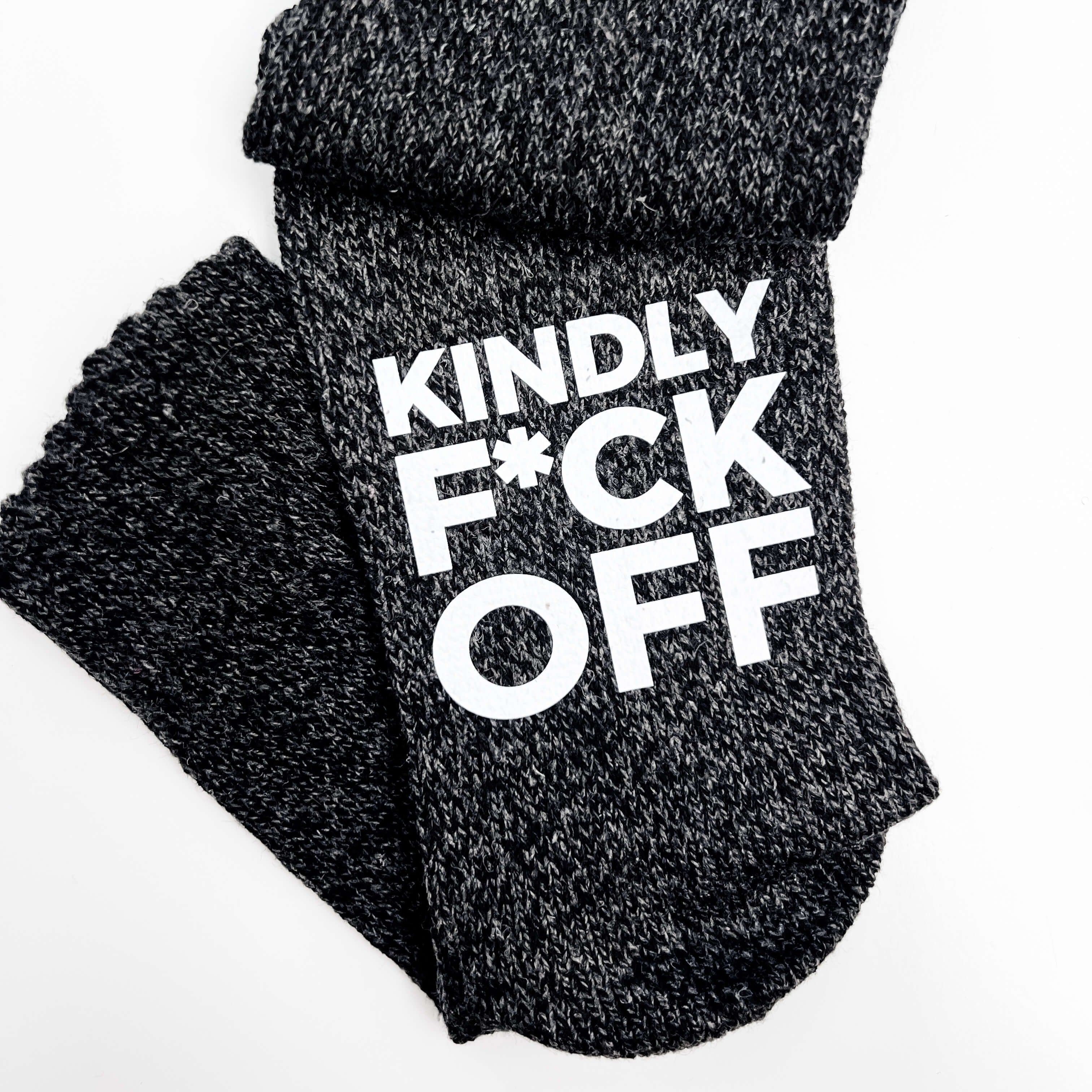 Black socks with white text on a white background