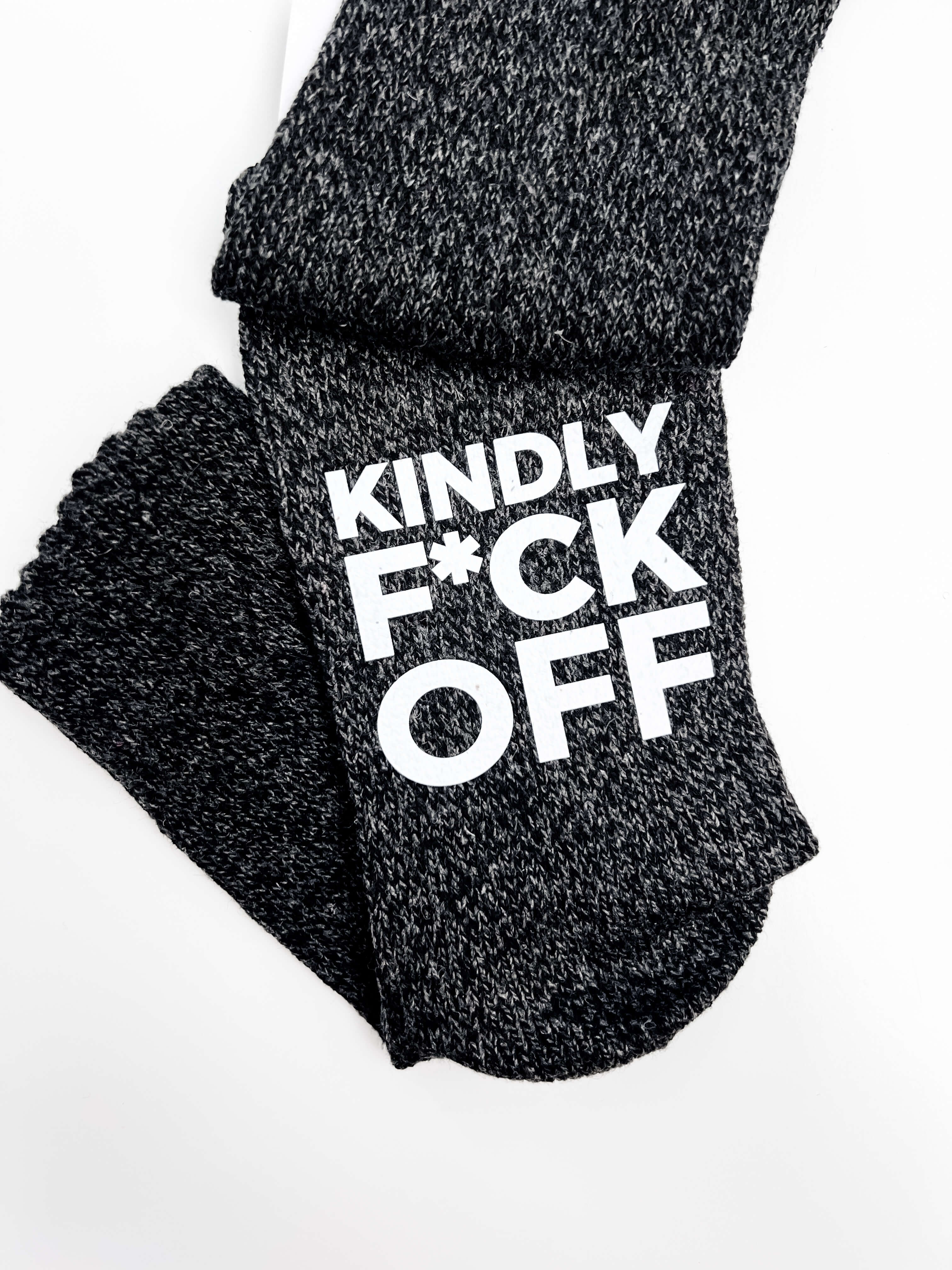 Black socks with white text on a white background