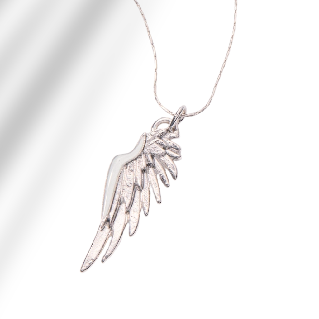 A silver angel wing pendant necklace on a delicate silver chain, set against a clean white background with soft diagonal shadows.
