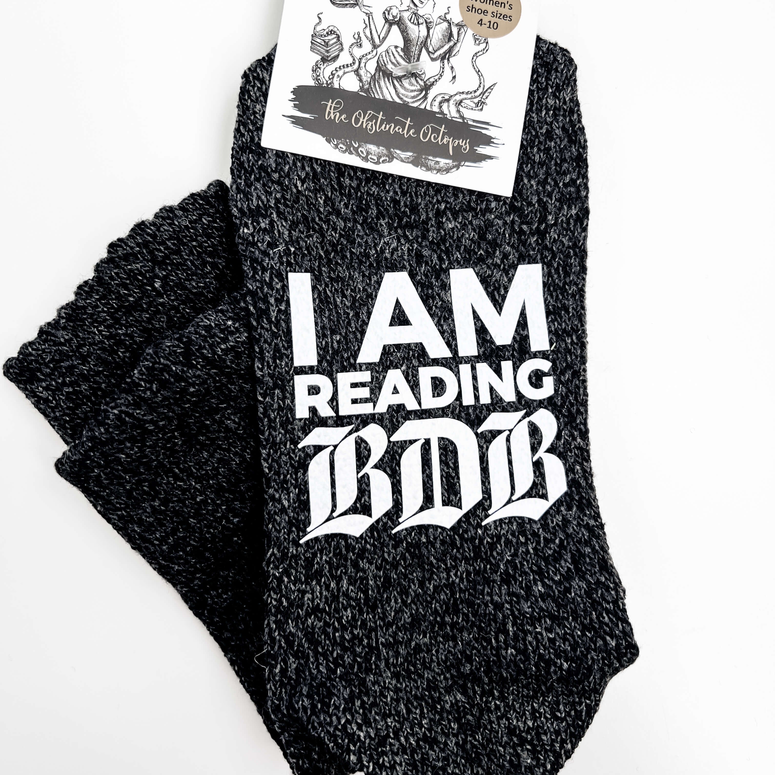 Black socks with 'I AM READING BDB' text on a white background
