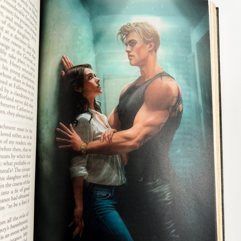 An open book showing a printed page with text on one side and a large illustrated cover or spread on the other, featuring a muscular blond man in a black tank top holding a woman against a teal-toned wall.