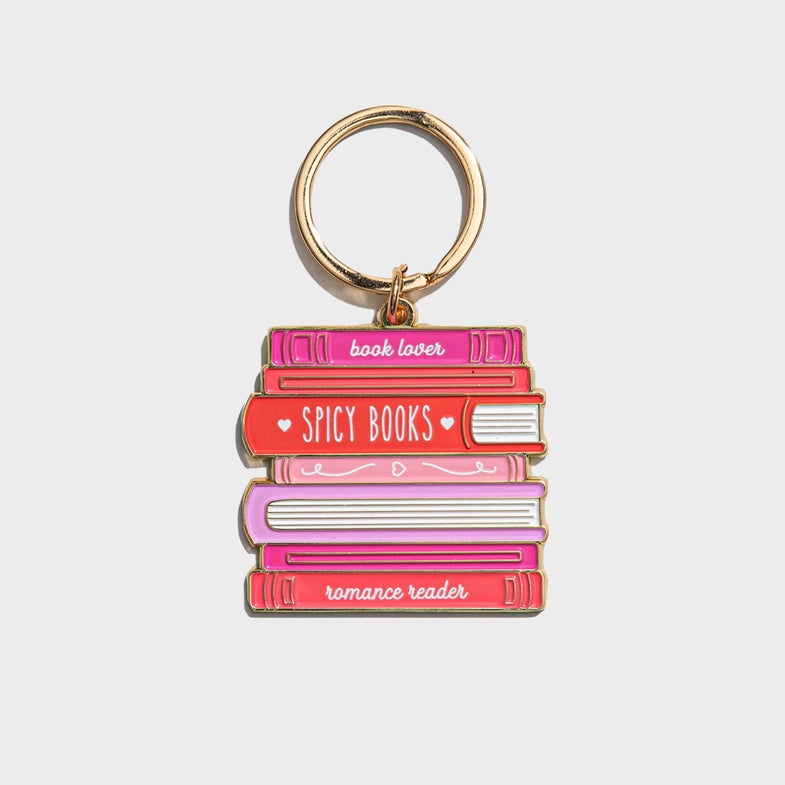 Keychain with book design and text on a light gray background