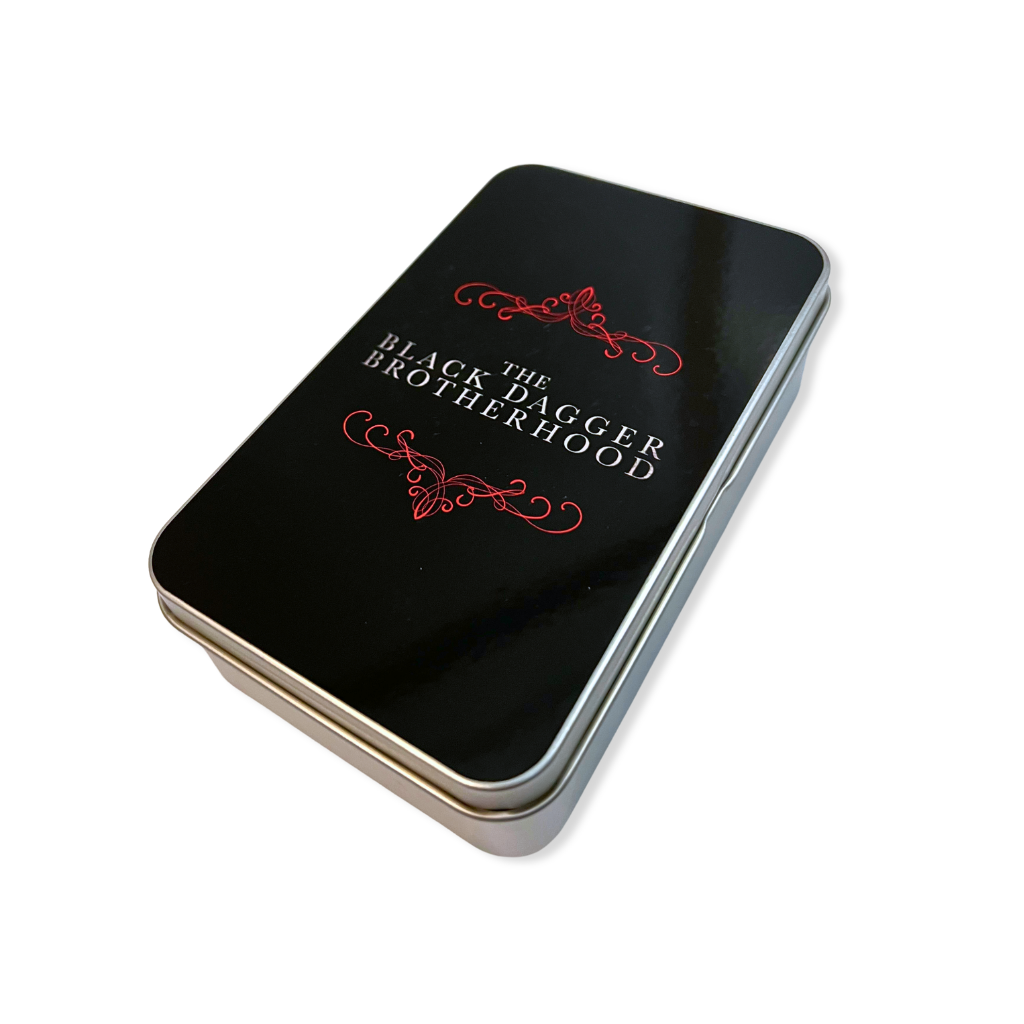Black tin box with 'The Black Dagger Brotherhood' text and red design on a white background